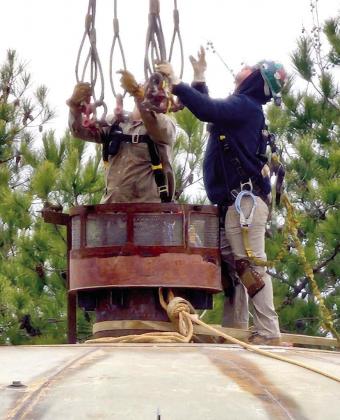 Lonnie Lund’s crew is busy at work on the Atlanta water tower. Local crew sees BIG