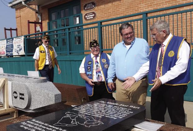 The mayor of Atlanta (center, third from left) James Brooks has more than a smile. He has a big grin that’s good for politics. He’s happy at the moment to be helping the Atlanta Legionnaires from the J. B. Manning Post 258. Faces