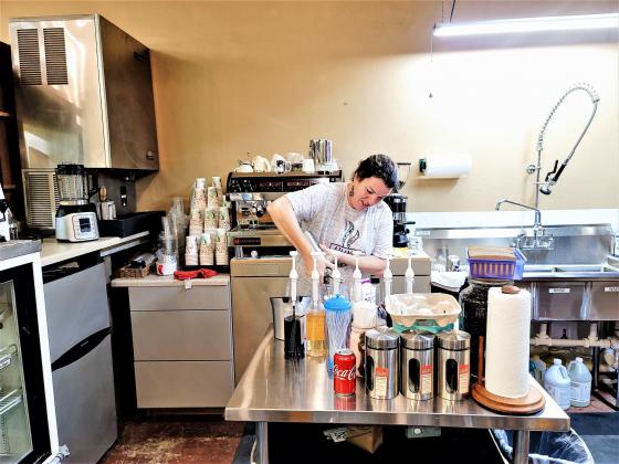 Barista and owner Melissa Smith prepares a latte. Photo by Kate Stow New coffeeshop ready for cooler temps