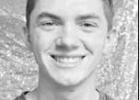 ETHAN COMER
