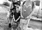 Jozie, fifth grade, Cameron, kindergarten, and Rylea, sixth grade, get in a first day of school photo before being dropped off at their respective Atlanta ISD school. Article Image Alt Text