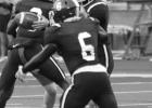 Rabbit QB Brayden Thompson hands the ball off to running back Marshawn Woodberry.