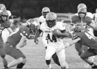 Photo by PHYLLIS WARREN Jeremiah Drayton splits the Winnsboro defense on his way down field. Article Image Alt Text