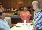 Illine Blizzard, right, stands and smiles. She’s just been introduced as the oldest alumni of the Huffines School attending a reunion last week. She’s 95