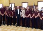 Texas State Representative Gary VanDeaver, center, poses with Texas A&M University-Texarkana Instructor Nicole Eant, MSN, RN, CNE; and her Level IV BSN students. Eant said she brought her students— slated to graduate in December— to show them how VanDeaver visits Cass County as new Rep