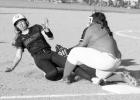 A Queen City runner is tagged out in the Lady Bulldogs’ loss to DeKalb. Photo by SUSAN LINDSEY Sports News