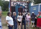 Being first on the Juneteenth tour last week is this group of neighbors. They are members of the Fallwell, Monroe and Small families and have come to see more closely the“Last Railway Station” public art display. The tour guide is Sharon Haynes, the p Being first on the Juneteenth tour last week is this group of neighbors. They are members of the Fallwell, Monroe and Small families and have come to see more closely the“Last Railway Station” public art display. The tour guide is Sharon Haynes, the p
