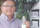 Hughes Springs City Manager Tim Lambert holds an example of Chalybeate Springs water. This is not real, however. The bottle is empty but was once a promotional idea by the chamber of commerce. Lambert tells he believes someone in the town has a real, full Hughes Springs City Manager Tim Lambert holds an example of Chalybeate Springs water. This is not real, however. The bottle is empty but was once a promotional idea by the chamber of commerce. Lambert tells he believes someone in the town has a real, full