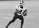 Senior speedster Jayden Riley looks for a crease against the Roughneck defense. Riley shredded White Oak for 76 yards rushing.