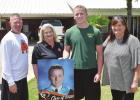 Queen City staff members deliver Senior Signs to graduates