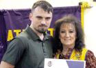 Leo Trent Treadway received his Leo welcome packet from sponsor Lion Debra Durr at the Leo Banquet. Photo by Tim Emmons Leo Trent Treadway received his Leo welcome packet from sponsor Lion Debra Durr at the Leo Banquet. Photo by Tim Emmons