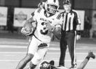 Atlanta receiver CJ Whaley leaves a Lion defender on the ground as he sprints for the endzone. Photo by Susan Lindsey