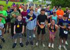 Runners gather for a photo after the annual Linden Wildflower Trails 5K Run. Photo by BETTY COLEMAN Runners gather for a photo after the annual Linden Wildflower Trails 5K Run. Photo by BETTY COLEMAN