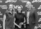 Stephanie Byrum, PhD, a graduate of the AHS class of 2000, was honored during the Distinguished Alumni 2024 ceremony on Sept. 27. Byrum is pictured with the Atlanta Education Foundation Alumni Representative Jaci Price and Atlanta ISD Superintendent Jason Harris. Photos courtesy of Rebecca Potter/Atlanta ISD