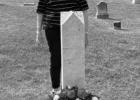 Merle Duncan at the grave of her great great grandmother Louisa Tucker Robinson in Pleasant Hill Cemetery at Bryans Mill.
